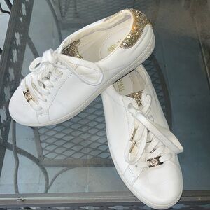 Women's Michael Kores flat trainers with gold glitter